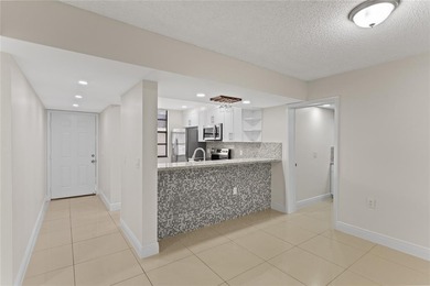 Beautiful 2-bedroom, 2-bathroom condo with a versatile bonus on Pine Island Ridge Country Club in Florida - for sale on GolfHomes.com, golf home, golf lot