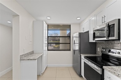 Beautiful 2-bedroom, 2-bathroom condo with a versatile bonus on Pine Island Ridge Country Club in Florida - for sale on GolfHomes.com, golf home, golf lot