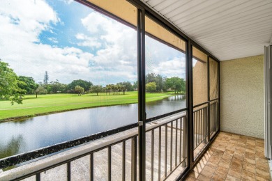 Enjoy stunning lake and golf course views from this beautifully on Fountains Golf and Country Club in Florida - for sale on GolfHomes.com, golf home, golf lot
