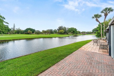 Enjoy stunning lake and golf course views from this beautifully on Fountains Golf and Country Club in Florida - for sale on GolfHomes.com, golf home, golf lot