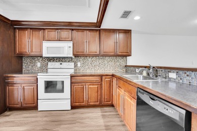 Welcome to 1701 Presidential Way, a beautifully renovated on The President Country Club in Florida - for sale on GolfHomes.com, golf home, golf lot