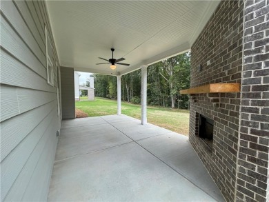 Stunning 2-story home with a 3rd car garage in a coveted on Traditions of Braselton Golf Club in Georgia - for sale on GolfHomes.com, golf home, golf lot