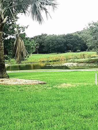 Over 1 acre in the desirable Habitat Community overlooking a on Sunnybreeze Golf Course in Florida - for sale on GolfHomes.com, golf home, golf lot