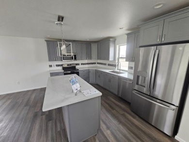 Brand new construction. Located in Hidden Bridge Ranch across on Hidden Bridge Golf Club in Wyoming - for sale on GolfHomes.com, golf home, golf lot
