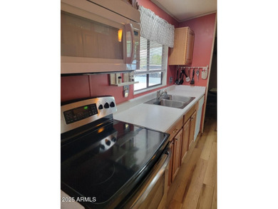 This is a lovely 2 bedroom 2 bath partially furnished home on 3 Parks Fairways in Arizona - for sale on GolfHomes.com, golf home, golf lot