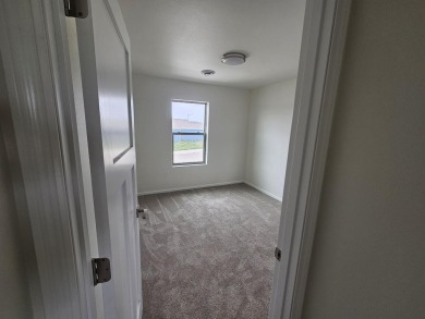 Brand new construction. Located in Hidden Bridge Ranch across on Hidden Bridge Golf Club in Wyoming - for sale on GolfHomes.com, golf home, golf lot