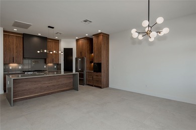 Experience modern luxury and energy-efficient living in this on Los Lagos Golf Club in Arizona - for sale on GolfHomes.com, golf home, golf lot