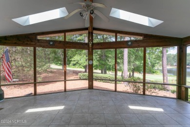 This unique brick home overlooking the 10th green of the award on Seven Lakes Country Club in North Carolina - for sale on GolfHomes.com, golf home, golf lot