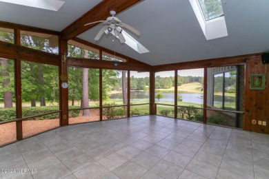 This unique brick home overlooking the 10th green of the award on Seven Lakes Country Club in North Carolina - for sale on GolfHomes.com, golf home, golf lot