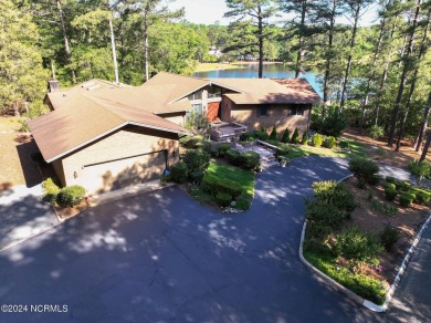 This unique brick home overlooking the 10th green of the award on Seven Lakes Country Club in North Carolina - for sale on GolfHomes.com, golf home, golf lot