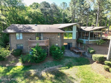 This unique brick home overlooking the 10th green of the award on Seven Lakes Country Club in North Carolina - for sale on GolfHomes.com, golf home, golf lot