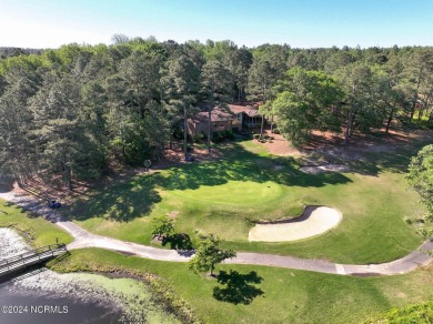 This unique brick home overlooking the 10th green of the award on Seven Lakes Country Club in North Carolina - for sale on GolfHomes.com, golf home, golf lot