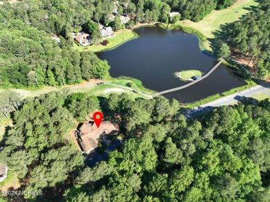 This unique brick home overlooking the 10th green of the award on Seven Lakes Country Club in North Carolina - for sale on GolfHomes.com, golf home, golf lot