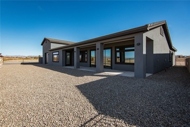 Experience modern luxury and energy-efficient living in this on Los Lagos Golf Club in Arizona - for sale on GolfHomes.com, golf home, golf lot