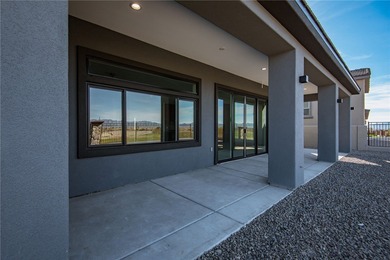 Experience modern luxury and energy-efficient living in this on Los Lagos Golf Club in Arizona - for sale on GolfHomes.com, golf home, golf lot