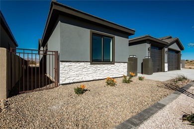 Experience modern luxury and energy-efficient living in this on Los Lagos Golf Club in Arizona - for sale on GolfHomes.com, golf home, golf lot