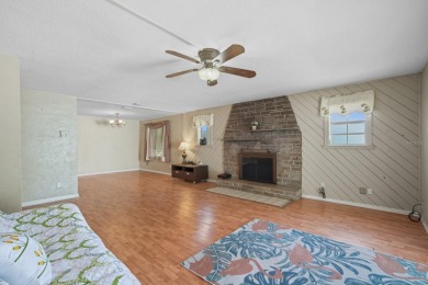 Savor the Florida lifestyle in this charming three-bedroom pool on Daytona Beach Golf Club in Florida - for sale on GolfHomes.com, golf home, golf lot