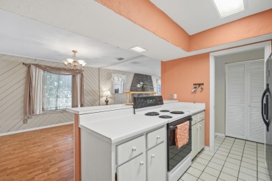Savor the Florida lifestyle in this charming three-bedroom pool on Daytona Beach Golf Club in Florida - for sale on GolfHomes.com, golf home, golf lot
