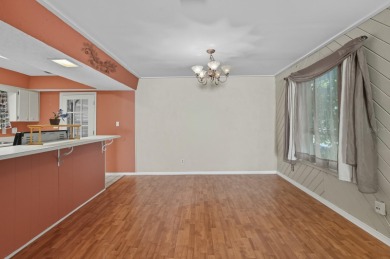 Savor the Florida lifestyle in this charming three-bedroom pool on Daytona Beach Golf Club in Florida - for sale on GolfHomes.com, golf home, golf lot