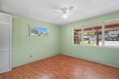Savor the Florida lifestyle in this charming three-bedroom pool on Daytona Beach Golf Club in Florida - for sale on GolfHomes.com, golf home, golf lot