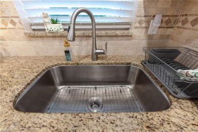 Welcome to this fun, friendly, and highly sought-after 55+ on Riviera Golf Club in Florida - for sale on GolfHomes.com, golf home, golf lot