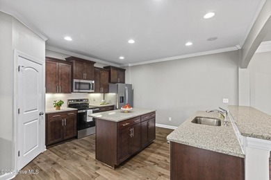 Beautifully maintained Wadsworth Mungo two-story home located in on Beau Rivage Golf and Resort in North Carolina - for sale on GolfHomes.com, golf home, golf lot