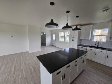 Brand new construction. Located in Hidden Bridge Ranch across on Hidden Bridge Golf Club in Wyoming - for sale on GolfHomes.com, golf home, golf lot