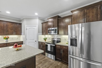 Beautifully maintained Wadsworth Mungo two-story home located in on Beau Rivage Golf and Resort in North Carolina - for sale on GolfHomes.com, golf home, golf lot