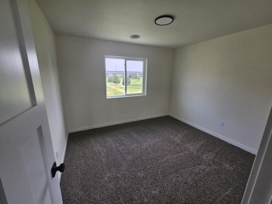 Brand new construction. Located in Hidden Bridge Ranch across on Hidden Bridge Golf Club in Wyoming - for sale on GolfHomes.com, golf home, golf lot