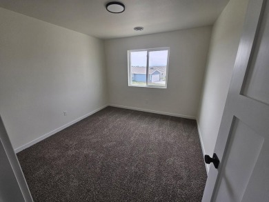 Brand new construction. Located in Hidden Bridge Ranch across on Hidden Bridge Golf Club in Wyoming - for sale on GolfHomes.com, golf home, golf lot