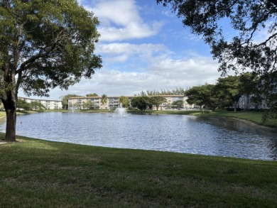 Wow, what a view! This 2-bedroom, 2-bath deluxe ground-floor on Wynmoor Golf Course in Florida - for sale on GolfHomes.com, golf home, golf lot