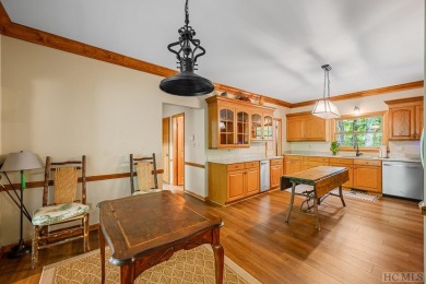 Discover the idyllic mountain charm of this four-bedroom on Sapphire National Golf Club in North Carolina - for sale on GolfHomes.com, golf home, golf lot