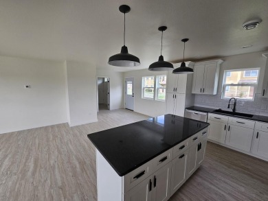 Brand new construction. Located in Hidden Bridge Ranch across on Hidden Bridge Golf Club in Wyoming - for sale on GolfHomes.com, golf home, golf lot
