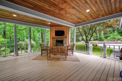 Discover the idyllic mountain charm of this four-bedroom on Sapphire National Golf Club in North Carolina - for sale on GolfHomes.com, golf home, golf lot