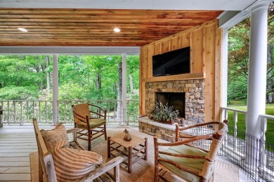 Discover the idyllic mountain charm of this four-bedroom on Sapphire National Golf Club in North Carolina - for sale on GolfHomes.com, golf home, golf lot