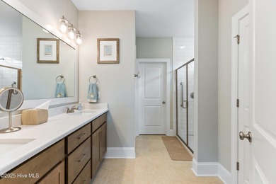 This like new, charming residence, built in 2023 by Bill Clark on Compass Pointe Golf Course in North Carolina - for sale on GolfHomes.com, golf home, golf lot