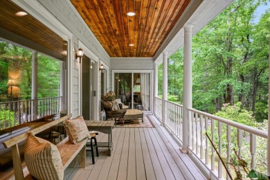 Discover the idyllic mountain charm of this four-bedroom on Sapphire National Golf Club in North Carolina - for sale on GolfHomes.com, golf home, golf lot