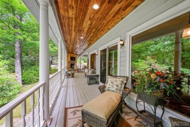 Discover the idyllic mountain charm of this four-bedroom on Sapphire National Golf Club in North Carolina - for sale on GolfHomes.com, golf home, golf lot