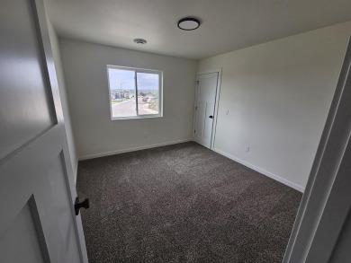 Brand new construction. Located in Hidden Bridge Ranch across on Hidden Bridge Golf Club in Wyoming - for sale on GolfHomes.com, golf home, golf lot