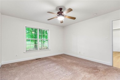Fully updated in 2025 from top to bottom, this stunning 3BR/2BA on Lake Louise Golf Club in North Carolina - for sale on GolfHomes.com, golf home, golf lot