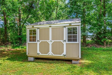 Fully updated in 2025 from top to bottom, this stunning 3BR/2BA on Lake Louise Golf Club in North Carolina - for sale on GolfHomes.com, golf home, golf lot