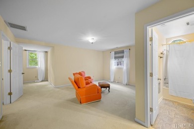 Discover the idyllic mountain charm of this four-bedroom on Sapphire National Golf Club in North Carolina - for sale on GolfHomes.com, golf home, golf lot