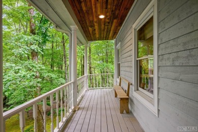 Discover the idyllic mountain charm of this four-bedroom on Sapphire National Golf Club in North Carolina - for sale on GolfHomes.com, golf home, golf lot