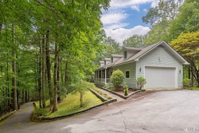 Discover the idyllic mountain charm of this four-bedroom on Sapphire National Golf Club in North Carolina - for sale on GolfHomes.com, golf home, golf lot