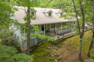Discover the idyllic mountain charm of this four-bedroom on Sapphire National Golf Club in North Carolina - for sale on GolfHomes.com, golf home, golf lot