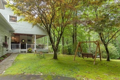Discover the idyllic mountain charm of this four-bedroom on Sapphire National Golf Club in North Carolina - for sale on GolfHomes.com, golf home, golf lot