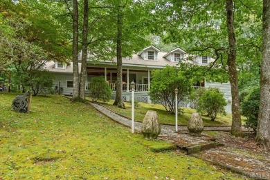 Discover the idyllic mountain charm of this four-bedroom on Sapphire National Golf Club in North Carolina - for sale on GolfHomes.com, golf home, golf lot