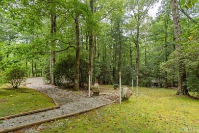 Discover the idyllic mountain charm of this four-bedroom on Sapphire National Golf Club in North Carolina - for sale on GolfHomes.com, golf home, golf lot