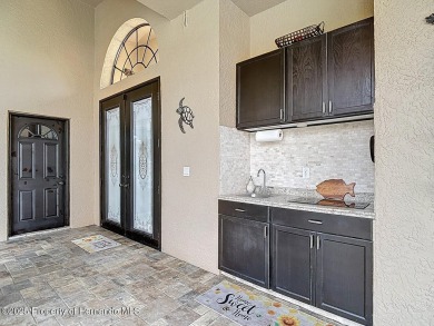 Stunning 3 bedrooms + office, 3 bath + 3 car garage Cabana Pool on Southern Woods Golf Club in Florida - for sale on GolfHomes.com, golf home, golf lot