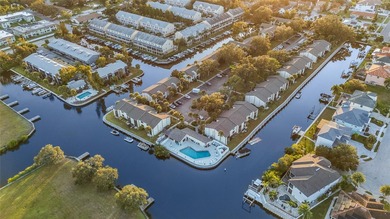 Waterfront Living. Gulf Access. Sunsets from Your Balcony. This on Tarpon Springs Golf Course in Florida - for sale on GolfHomes.com, golf home, golf lot